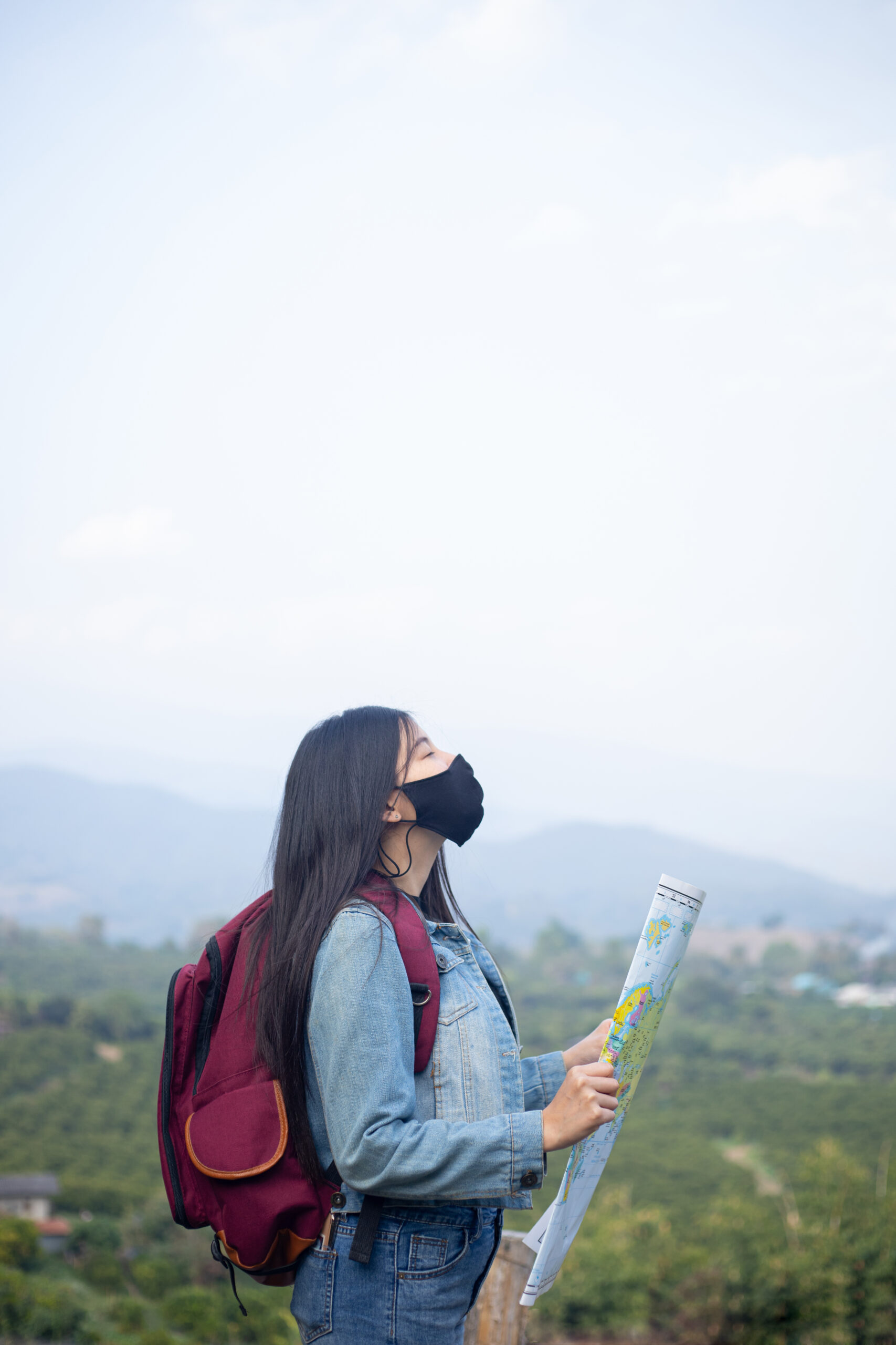 traveler girl searching right direction on map